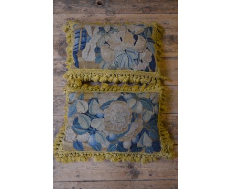 Two cushions made from antique wool tapestry with old gold tasseled fringing, backed with teal velvet