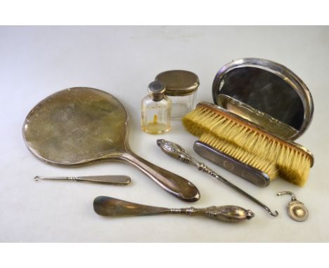 Two silver mirrors, toilet jars, button hooks and shoe horn, sports medallion, etc.