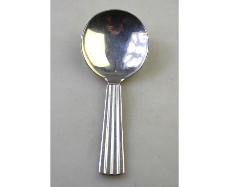 A Georg Jensen silver Bernadotte pattern caddy spoon with Art Deco style reeded handle, London import 1962