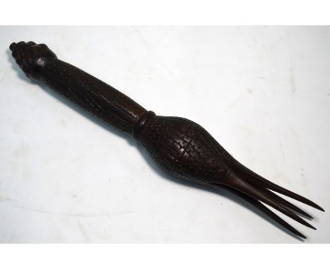 A Polynesian Ceremonial Cannibal fork, turned wood with berry-like finial, carved overall with notched fluting and with four 