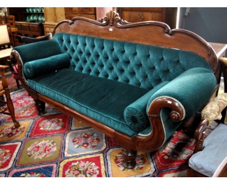 A Regency mahogany framed button backed sofa with scroll over arms raised on turned legs, 220 cm long