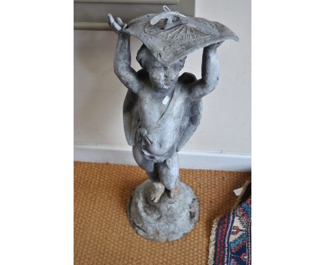 A cast lead figure of a cherub, supporting a sundial, 75 cm high