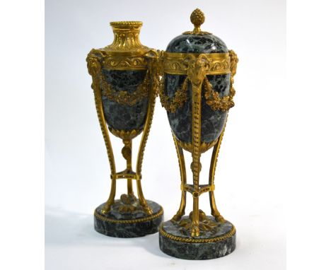 A fine pair of 19th century French ormolu mounted variegated green marble urns, the reversible covers doubling as candle hold