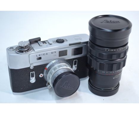 A Leitz Leica M5 camera no 1345363 with Summicron f=5cm 1:2 lens no 151 2024, to/w a Summicron 1:2/90 telephoto lens no 21513