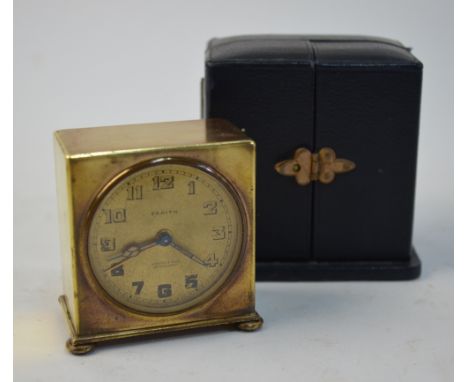 A Zenith Watch Co Swiss gilt metal travel alarm clock with gilt dial, 5.5 cm in blue morocco outer case, retailed by Brook & 