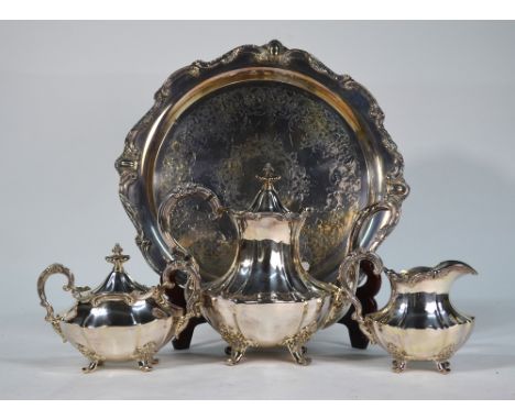 A US plate 'Victoria' pattern three piece tea service by Reed & Barton, on similar engraved circular tray