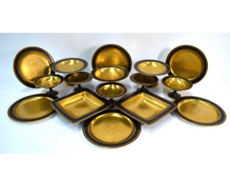 A Royal Worcester dessert service, black ground with gilded centres and foliate bands with enamelled coral jewels, retailed b