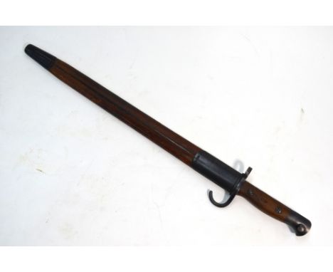 An Edwardian 1907 pattern bayonet with 43.5 cm fullered blade by Wilkinson, two-piece wood grip and steel-mounted leather sca