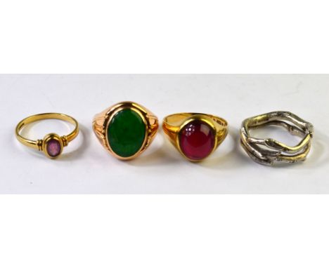 Four rings including green jade cabochon, yellow metal setting stamped 14k; ruby single stone, 9ct yellow gold; garnet caboch