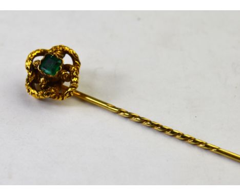 Victorian stick pin set square emerald in textured knot setting, yellow gold in unmarked case