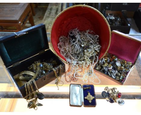 A large quantity of vintage costume and fashion jewellery including imitation pearls, gilt metal necklaces and bracelets, ear