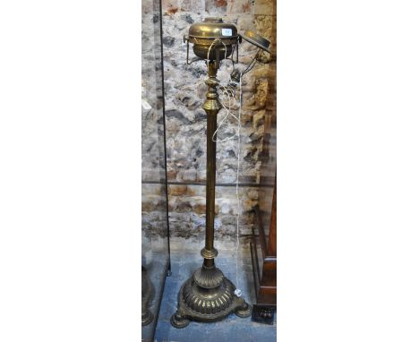 A Victorian lacquered brass rise and fall column oil lamp, later converted to electricity