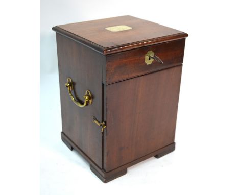 A George III mahogany travelling apothecary box, with brass carrying handles, the hinged top and door enclosing compartments 