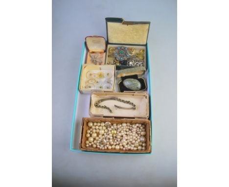A collection of various items including set of ten mother of pearl buttons, Scottish pebble brooch, simulated pearls, paste e