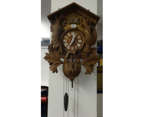A reproduction ornate German cuckoo clock.