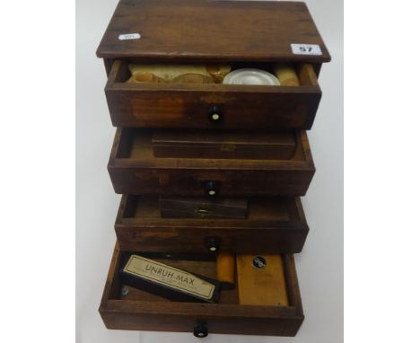 A small chest fitted with four drawers, various watchmaker components and small boxed tool set, U H-Max set etc., Seitz set, 