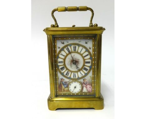 A 19th century French brass cased repeater and alarm carriage clock with porcelain dial and sides, decorated with panels of f