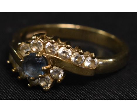 A 9ct gold cz and pale blue stone set ring, stamped 375, 3.6g gross