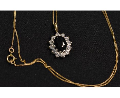 A lady's 9ct gold and diamond chain and pendent 