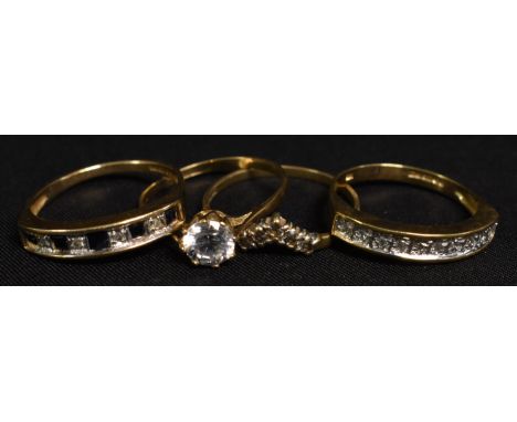 Rings - a solitaire dress ring, 9ct gold shank; others, 5.6g gross (4)