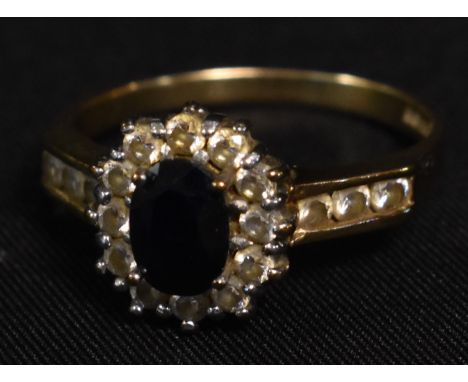 A 9ct gold cz and dark blue stone set dress ring, Sheffield 1998, 3.1g gross