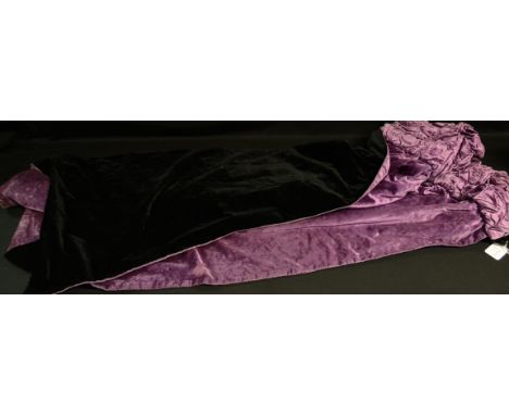Textiles - an Edwardian design lady's reversible velvet evening cape, black exterior and purple lining, button-fastening coll
