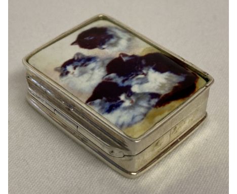 A small silver pill box with ceramic plaque set to hinged lid, depicting kittens. Stamped 925 inside. Approx. 3 x 2.5 x 1cm. 