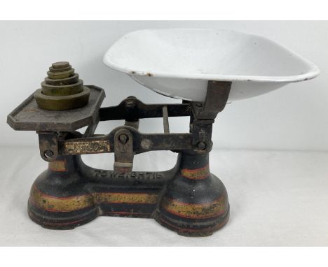 A set of vintage weighing scales by The Albion Foundry Ltd. With yellow and red painted detail. Complete with enamel tray and