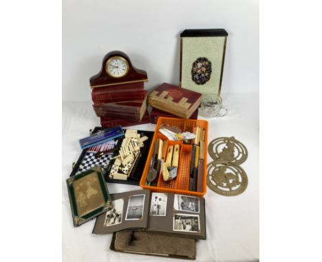 A box of assorted vintage items to include books, cutlery and ephemera. Lot includes: Regent of London 2 sided tray - with de