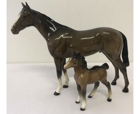 2 Beswick horse figurines. A Bois Roussell Racehorse together with a foal (a/f). Both in brown colourway with gloss finish. H