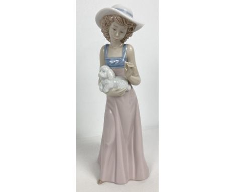 A retired Nao Spanish ceramic figurine "Pampered Poodle", 1991. Approx. 25cm tall. 