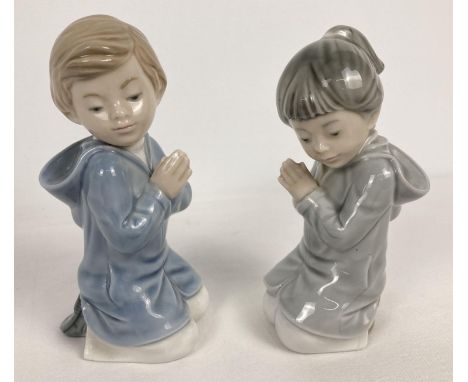 2 Nao Spanish ceramic figurines of a boy and girl praying. 1985, tallest approx. 13.5cm tall. 