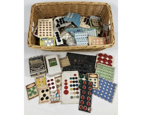 A large collection of vintage buttons in varying sizes and patterns. Most still on original cards, some in original boxes. To