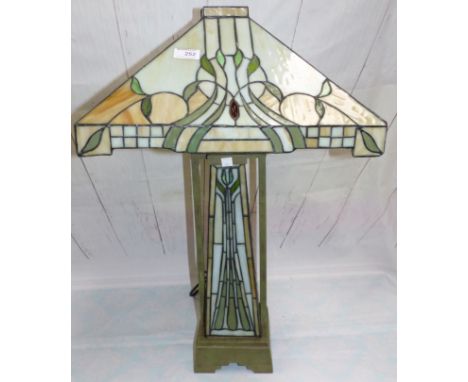 A Tiffany style leaded and coloured table lamp on leaded glass column; a gilt standard lamp with Tiffany style shade