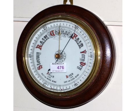 An early 20th century aneroid barometer; an ebonised walking cane with silver top (split); a brass candlestick; a small woode