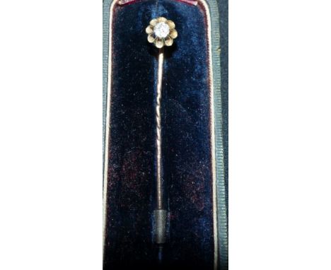 A 19th century 15 carat gold stick pin with open claw set diamond, cased