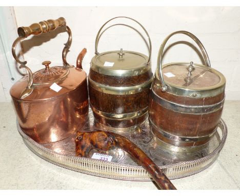 An oval silver plated gallery tray; 2 oak biscuit barrels with silver plated lids and mounts; a 19th century copper kettle; a