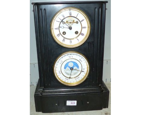 A 19th century French black slate architectural mantel clock, with white enamel dial and visible escapement and drum movement