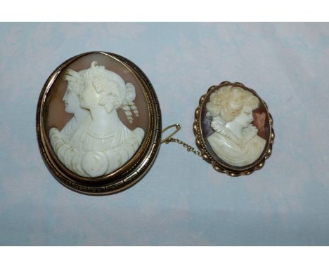 A Victorian cameo brooch carved with 2 classical female busts in Greek key and yellow metal surround; a female bust portrait 