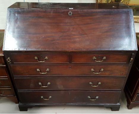 A Georgian mahogany fall front bureau with fitted interior, 3 long and 2 short drawers and bracket feet