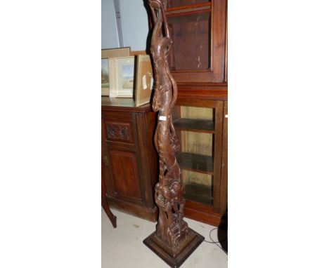 A Far Eastern carved wood standard lamp in the form of a dragon
