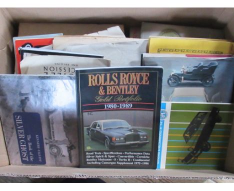 A box containing a quantity of books and ephemera relating to Rolls Royce, to include: Rolls Royce and Bentley Gold Portfolio