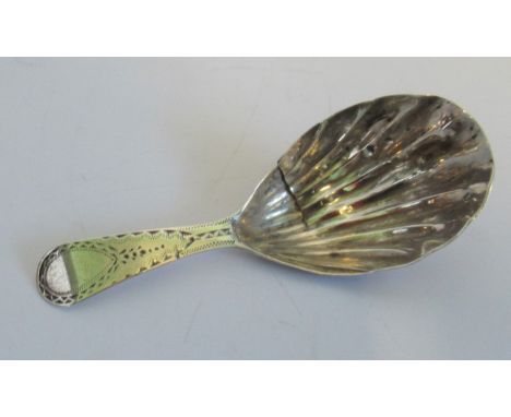 A silver George III caddy spoon, the engrave handle with vacant cartouche(AF). Condition Report: Split to centre of bowl. 