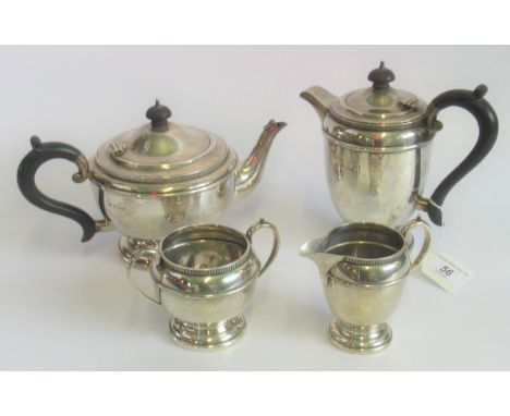 A hallmarked silver four piece tea set, comprising: sugar bowl, milk jug, teapot and coffee pot, Birmingham 1864/5, gross wei