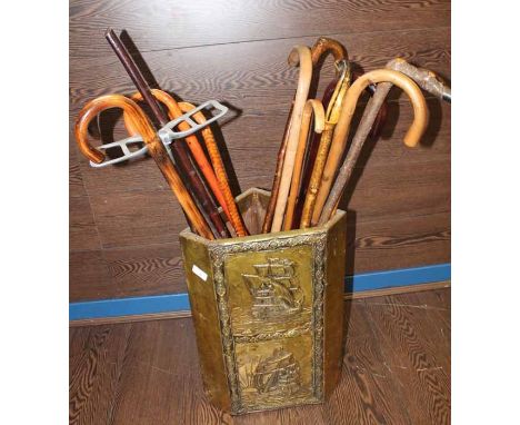 BRASS TRIANGULAR STICK STAND
and contents, including several wooden sticks. 