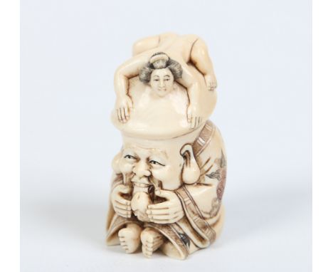 A Japanese erotic theme carved ivory netsuke, 4.5cm. Condition Report. To be used as a guide only. Good condition.