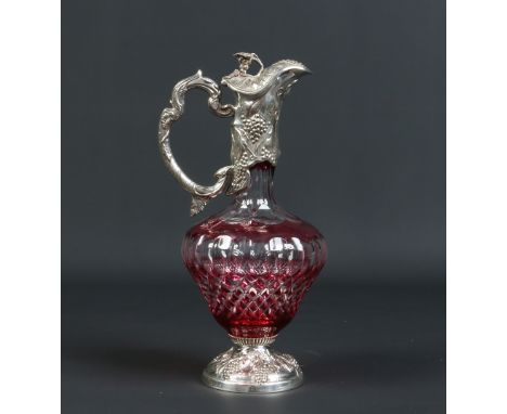 A cut glass and ruby flash claret jug with silver plated mounts chased with fruiting vines by Mappin and Webb, 32.5cm. Condit