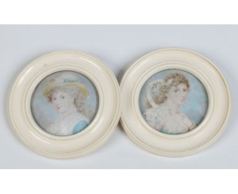 A pair of ivory framed circular portrait miniatures of women, 9cm overall diameter. Condition Report. To be used as a guide o