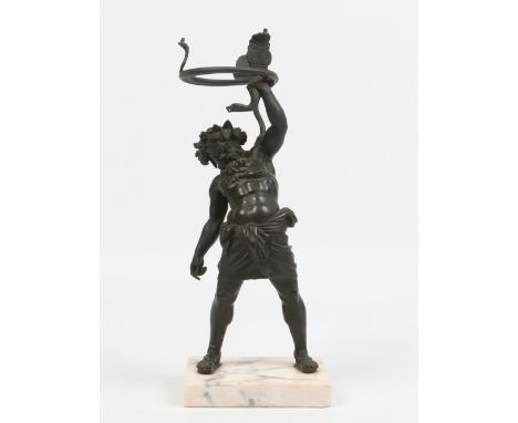 A bronzed figural table lamp base on marble plinth. Formed as Zeus holding a serpent above his head with anthemion shade supp