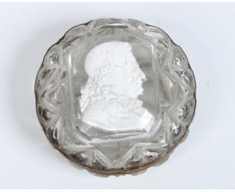 A nineteenth century cut glass trinket box and cover. With gilt metal mount and glass paste cameo portrait of a cardinal, 6cm